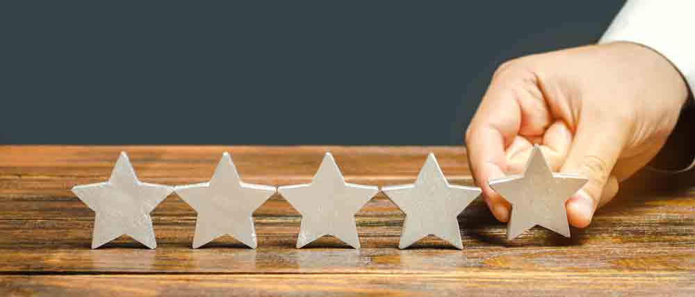 a hand placing stars